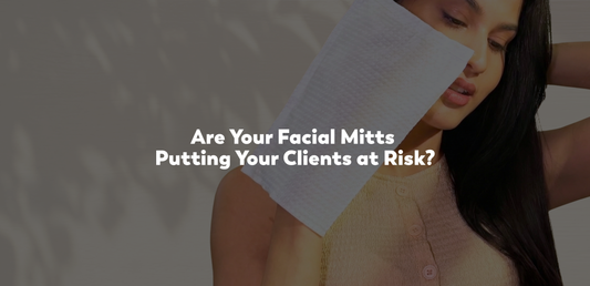 Are Your Facial Mitts Putting Your Clients at Risk? Model holding a single use facial mitt